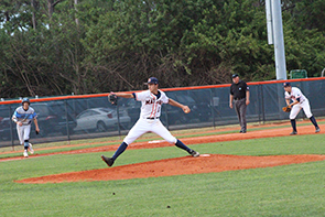 Baseball pitcher pitching a ball